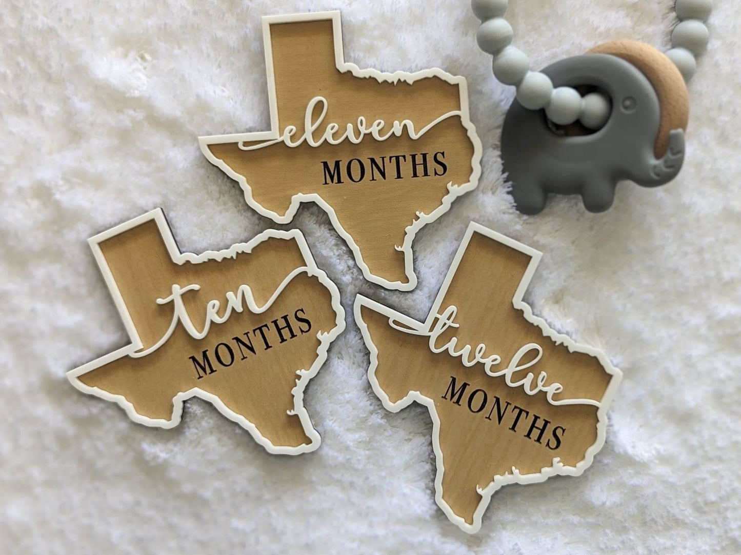 Texas shaped baby milestone props months ten, eleven and twelve.