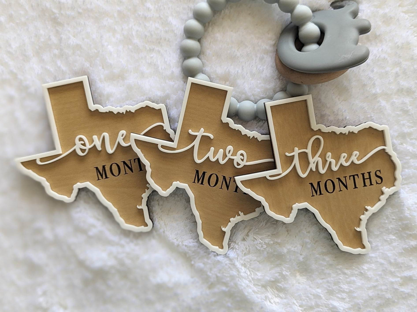 Texas shaped baby milestone props months one, two and three.